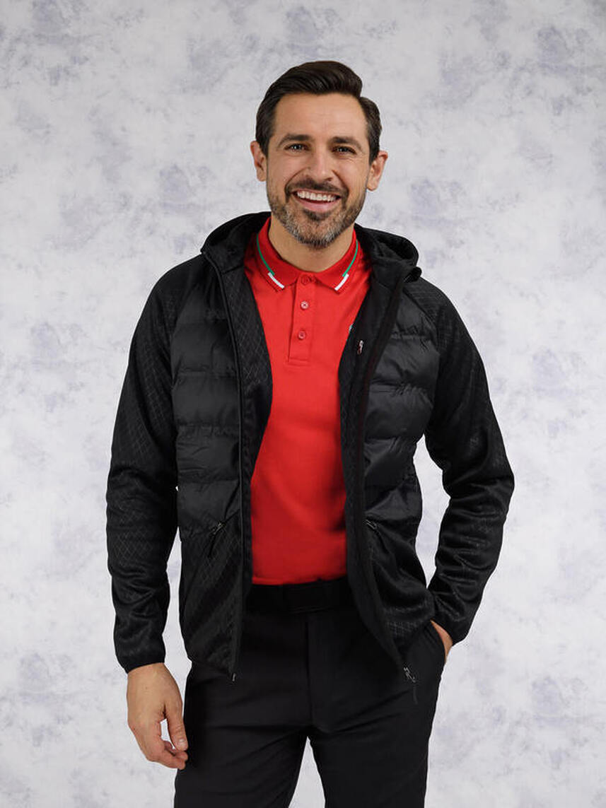 Picturea male model wearing a ryder cup polo shirt and black jacket