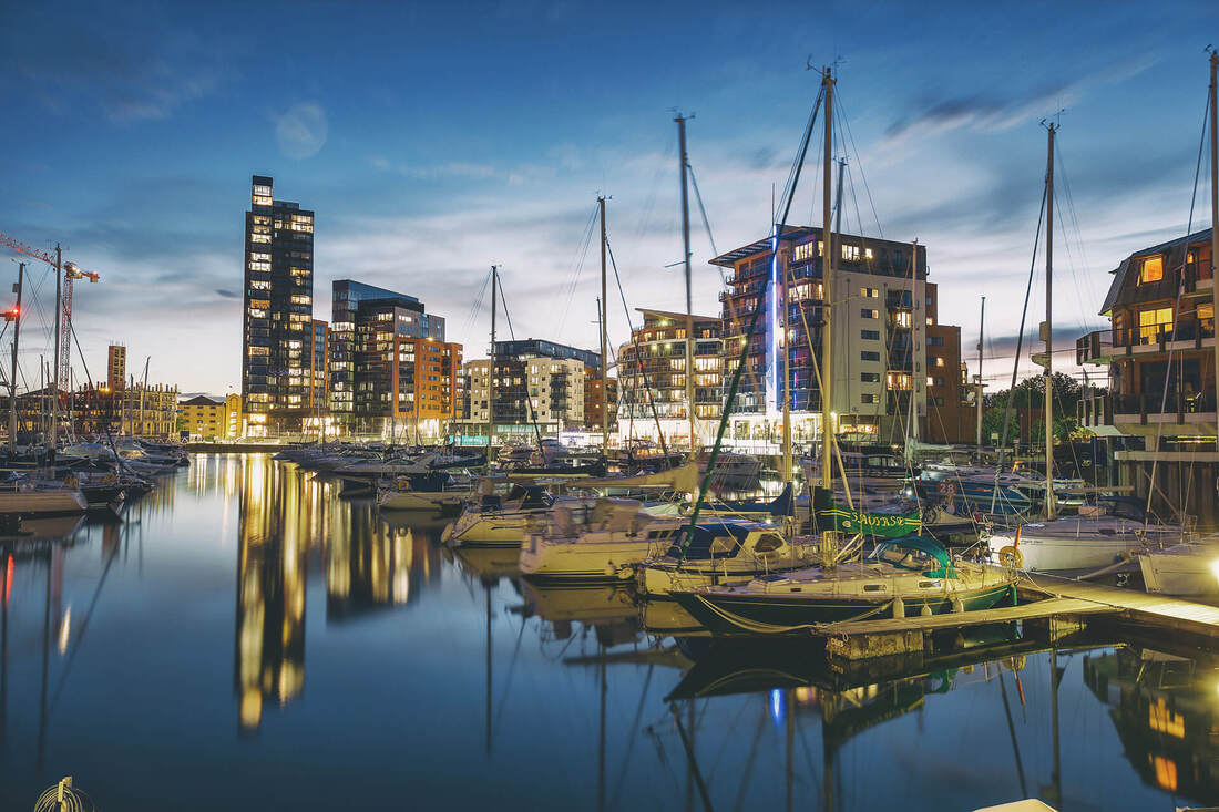 A nightime photograph of MDL Ocean Village marina in Southampton